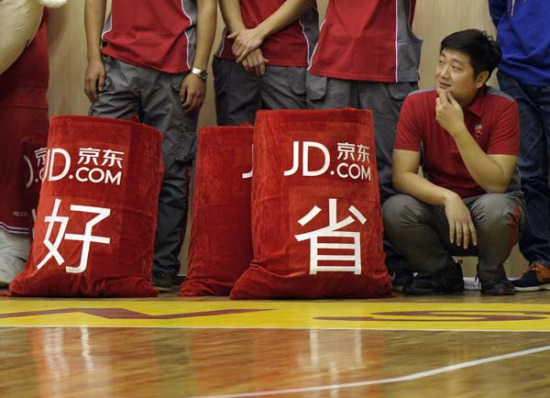 JD.com workers take part in a recent promotional event. (Provided to China Daily)