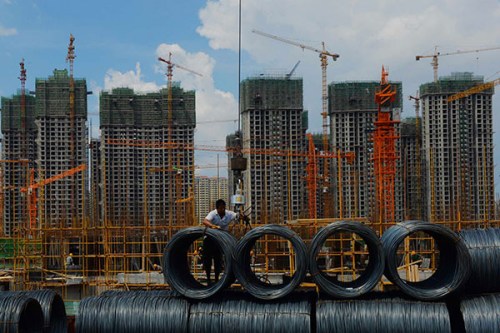 A massive residential project in Yanjiao, a town in Hebei province that borders Beijing. New home prices rose in 53 of the 100 major cities tracked by the China Index Academy in June, compared with the growth in 48 cities during May. (Photo/China Daily)