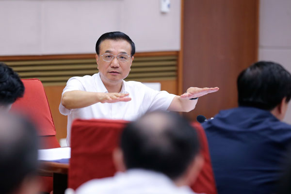 Premier Li Keqiang said China has the means to prevent regional and systemic risks on July 10 at seminar in Beijing. (Photo/China News Service)