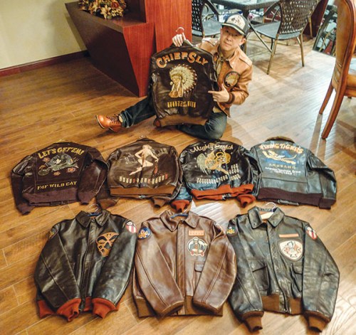 Yu Qian shows off his collection of flying jackets. The most expensive one costs almost 50,000 yuan. (Photo provided to China Daily)