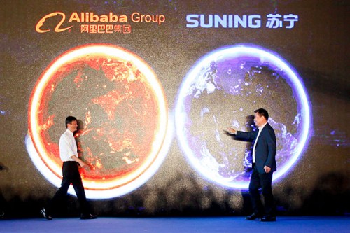 Alibaba buys 20% stake in Suning Chairman of Alibaba Jack Ma (left) and Zhang Jindong, founder of retailer Suning, at the press conference in Nanjing, capital of Jiangsu province, after the two companies reached a deal on Monday. (Photo/China Daily)
