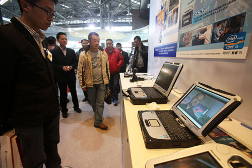 Reinforced Panasonic Corp laptops on display at an expo in Tianjin. The Japanese electronics company is set to close its lithium battery factory in Beijing. (Photo provided to China Daily)