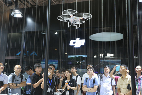 A flying photo drone is displayed at a recent exhibition in Beijing. (Xinhua/Xing Guangli)