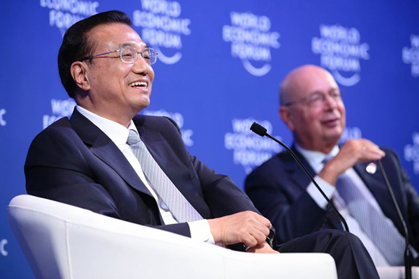 Chinese Premier Li Keqiang speaks with global corporate leaders at the Annual Meeting of the New Champions of the World Economic Forum in Dalian, Liaoning province on September 9, 2015. (Photo provided to China Daily)