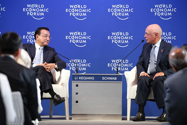 Chinese Premier Li Keqiang speaks with global corporate leaders at the Annual Meeting of the New Champions of the World Economic Forum in Dalian, Liaoning province on September 9, 2015. (Photo provided to China Daily)