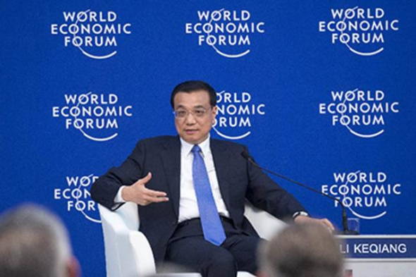 Chinese Premier Li Keqiang speaks with global corporate leaders at the Annual Meeting of the New Champions of the World Economic Forum in Dalian, Liaoning province on September 9, 2015. (Photo/Xinhua)