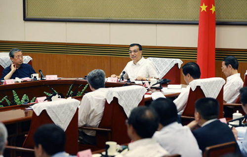 Chinese Premier Li Keqiang presides over a meeting on reforms of state-owned enterprises (SOEs) in Beijing, capital of China, Sept 18, 2015. Chinese Vice Premier Zhang Gaoli also attended the meeting. (Photo/Xinhua)