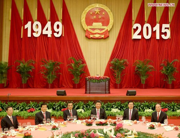 Chinese President Xi Jinping (3rd R), Premier Li Keqiang (3rd L), and senior leaders Zhang Dejiang (2nd R), Liu Yunshan (2nd L), Wang Qishan (1st R) and Zhang Gaoli attend a reception held by the State Council to celebrate the 66th anniversary of the founding of the People's Republic of China, in Beijing, capital of China, Sept. 30, 2015. (Xinhua/Yao Dawei)