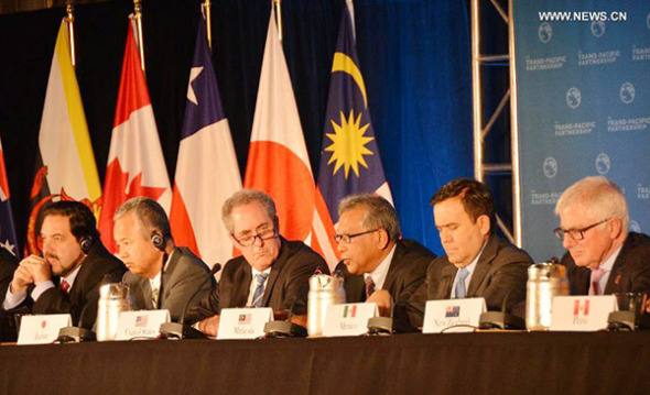 Trade ministers of the United States and 11 other Pacific Rim countries attend a press conference after negotiating the Trans-Pacific Partnership (TPP) trade agreement in Atlanta, the United States, on Oct. 5, 2015. Trade ministers of the United States and 11 other Pacific Rim countries have successfully concluded the Trans-Pacific Partnership (TPP) free trade talks, U.S. Trade Representative Michael Froman said Monday. (Photo/Xinhua)