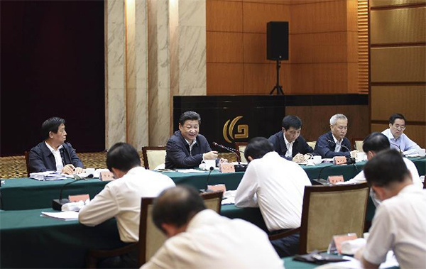 Chinese President Xi Jinping (2nd L, back), also general secretary of the Communist Party of China (CPC) Central Committee and chairman of the Central Military Commission, speaks during a meeting on the 13th five-year plan period (2016-2020) with leading officials from seven regions in east China: Shanghai, Anhui, Fujian, Jiangsu, Jiangxi, Shandong and Zhejiang in Hangzhou, capital of east China's Zhejiang Province, May 27, 2015.(Photo/Xinhua)