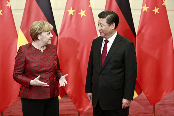 President Xi Jinping meets with German Chancellor Angela Merkel in Beijing on Thursday. (Photo: China Daily/Feng Yongbin)