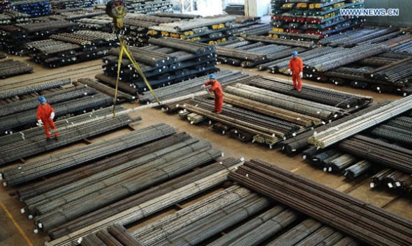 Workers are busy at a manufacture base of Dongbei Special Steel Group Co., Ltd. in Dalian, northeast China's Liaoning Province, Oct. 13, 2015. (Xinhua file photo/Liu Debin)