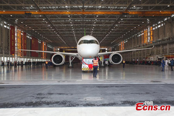 China's first large passenger jet C919 rolls off the production line in Shanghai municipality on November 2, 2015. The maiden test flight of the C919 is scheduled for 2016. So far, 450 orders from 18 domestic and foreign clients have been placed for the jetliner. (Photo: China News Service/ Zhang Hengwei)