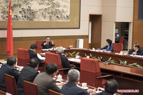 Chinese Premier Li Keqiang presides over a meeting of the country's leading group on education, science and technology in Beijing, capital of China, Dec. 3, 2015. (Xinhua/Li Xueren)