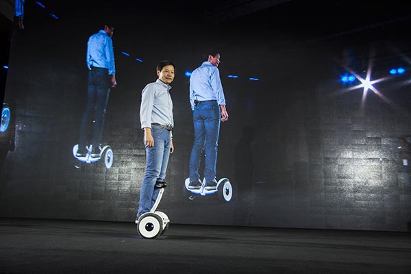Lei Jun, chief executive officer of Xiaomi Corp, rides on a Ninebot at its debut in October.(Provided to China Daily)