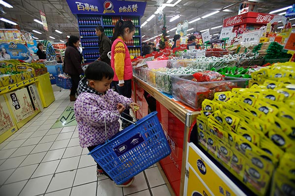 Customers shop at a supermarket in Hangzhou, Zhejiang province, earlier this month. China's private consumption is expected to increase by around 9 percent annually in the next five years.(Provided to China Daily)