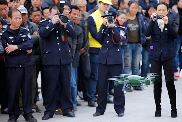 A drone to help crack down on illegal drugs in Huidong, Guangdong province, is demonstrated in 2014. (Photo: China Daily/Chen Weibin)