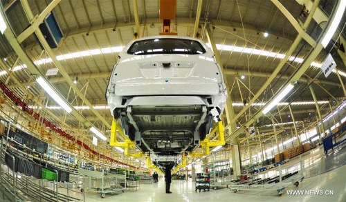 Workers are occupied on a production line at a workshop under the BAIC Motor in Huanghua city, north China's Hebei Province, Jan. 6, 2016.  China's economy grew by 6.9 percent in 2015. (Photo: Xinhua/Mou Yu)