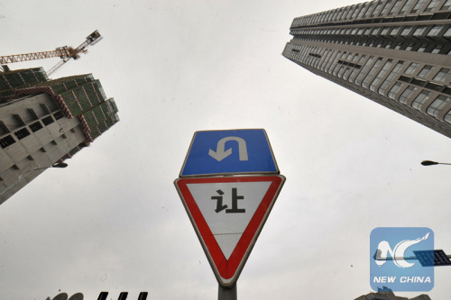 Photo taken on April 21, 2015 shows newly-built residential apartment buildings in the downtown of Changsha, capital of central China's Hunan Province. (Photo: Xinhua/Long Hongtao)