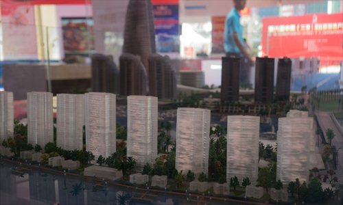 A model residential development aims to catch the eyes of homebuyers last week at a real estate exhibition in Sanya, South China's Hainan Province. (Photo: Chen Qingqing/GT)