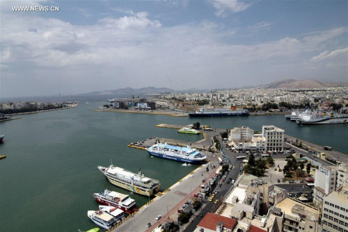 Ships are docked at Piraeus port in Athens, Greece on Feb. 17, 2016. The Greek privatization fund announced on Wednesday that China's COSCO was formally declared the preferred investor for the privatization of Greece's largest port, Piraeus. (Photo: Xinhua/Marios Lolos)