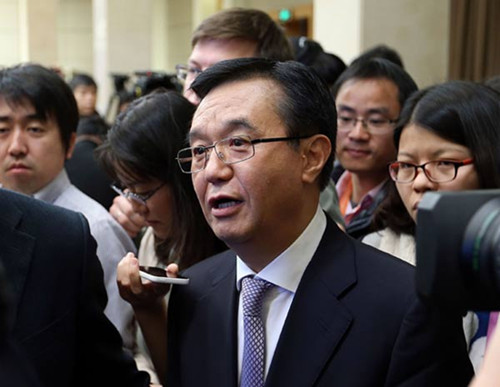 Minister of Commerce Gao Hucheng talks with reporters after a news conference in Beijing on Tuesday. WANG ZHUANGFEI / CHINA DAILY