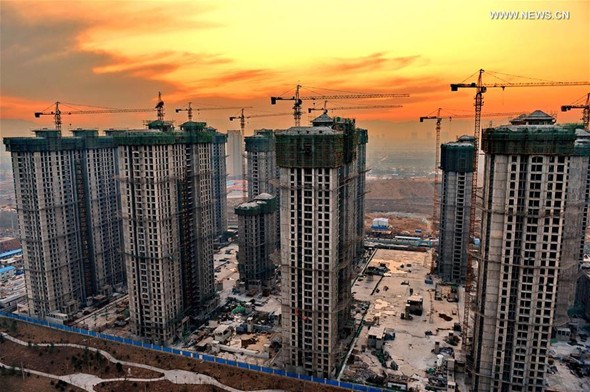 Photo taken on Feb. 17, 2016 shows a cluster of residential buildings under construction in Shijiazhuang, capital of north China's Hebei Province.(Xinhua/Mou Yu)  