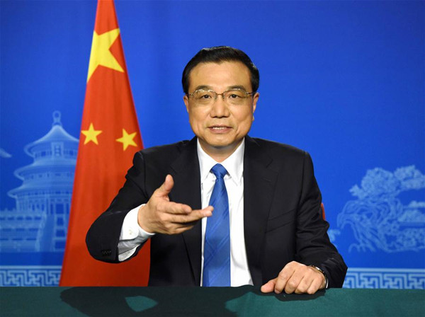 Chinese Premier Li Keqiang speaks in a video message to the G20 Finance Ministers and Central Bank Governors Meeting that opened in Shanghai, east China, Feb. 26, 2016. (Xinhua/Rao Aimin)