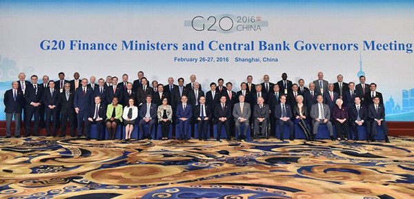 Officials pose for a family photo at the G20 Finance Ministers and Central Bank Governors Meeting at the Pudong Shangri-la Hotel in Shanghai, east China, Feb. 27, 2016. Chinese policymakers on Friday sketched out the country's economic policies and reform agenda, reassuring the world that the government has plenty policy tools to combat downward pressure as financial leaders from G20 nations gathered in Shanghai. (Photo: Xinhua/Li Xin)
