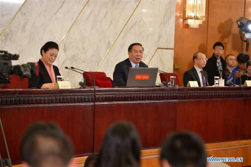 Wang Guoqing (C), spokesperson for the Fourth Session of the 12th Chinese People's Political Consultative Conference (CPPCC) National Committee, attends a press conference at the Great Hall of the People in Beijing, capital of China, March 2, 2016. (Photo: Xinhua/Li Xin)