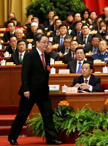 Yu Zhengsheng, chairman of the Chinese People's Political Consultative Conference National Committee, takes the stage to deliver the top advisory body's work report in the Great Hall of the People in Beijing on Thursday. (Photo: China Daily/Zou Hong)