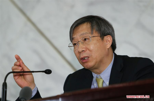Yi Gang, a member of the 12th National Committee of the Chinese People's Political Consultative Conference, answers questions during a press conference on the supply-side structural reform at the Great Hall of the People in Beijing, capital of China, March 6, 2016. (Xinhua/Chen Junqing)