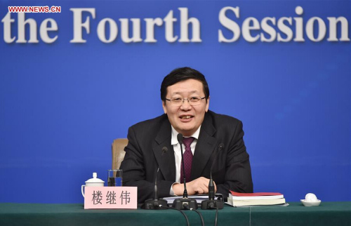 Chinese Minister of Finance Lou Jiwei gives a press conference on the sidelines of the fourth session of China's 12th National People's Congress at the press center in Beijing, capital of China, March 7, 2016. (Photo: Xinhua/Li Xin)