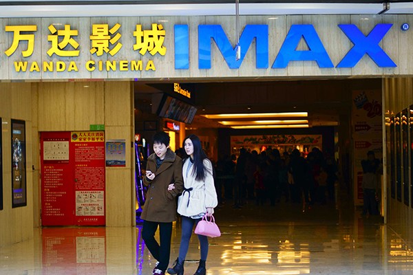 Moviegoers walk out of a Wanda cinema in Yichang, Hubei province. (Photo/China Daily)