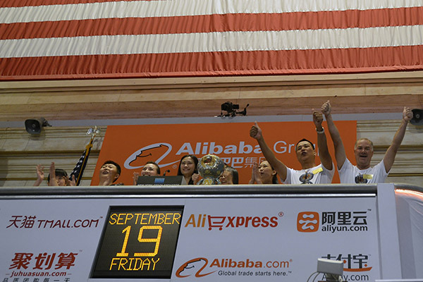 Representatives of Alibaba Group hail the company's IPO at the New York Stock Exchange on Sept 19, 2014. (Photo/Xinhua)