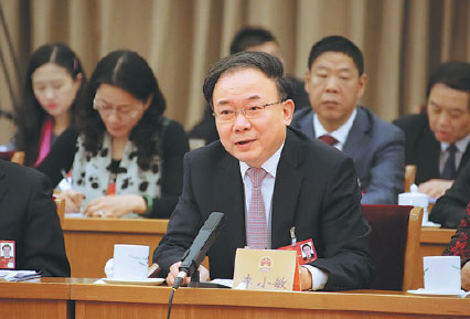 Li Xiaomin, top leader of Wuxi, raises his point during a panel discussion. Provided to China Daily