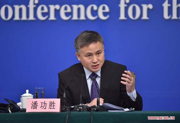 Pan Gongsheng, deputy governor of the People's Bank of China and director of the State Administration of Foreign Exchange, answers questions at a press conference on the financial reform and development on the sidelines of the fourth session of the 12th National People's Congress in Beijing, capital of China, March 12, 2016. (Xinhua/LiXin)
