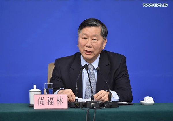 Chairman of the China Banking Regulatory Commission Shang Fulin answers questions at a press conference on the sidelines of the fourth session of the 12th National People's Congress in Beijing, capital of China, March 12, 2016. (Xinhua/Li Xin)