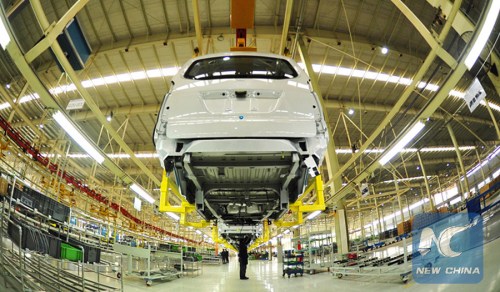 Workers are occupied on a production line at a workshop under the BAIC Motor in Huanghua city, north China's Hebei Province, Jan. 6, 2016. (Xinhua/Mou Yu)