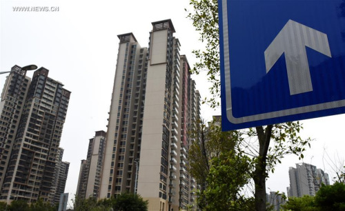 Photo taken on March 12, 2016 shows residential building on sell in Guangzhou, capital of south China's Guangdong Province. (Photo: Xinhua/Lu Hanxin)