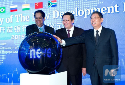 Chinese Finance Minister Lou Jiwei (C), Shanghai Mayor Yang Xiong (R) and President of the New Development Bank (NDB) of BRICS K.V. Kamath attend the launching ceremony of the bank in Shanghai, east China, July 21, 2015. (Xinhua/Zhang Chunhai)