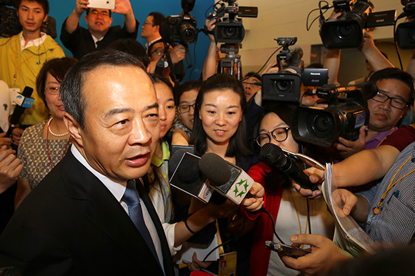 Mao Chaofeng, executive deputy governor of Hainan province, is interviewed after a news conference on the sidelines of the Boao Forum for Asia on Wednesday. (Photo/China Daily)