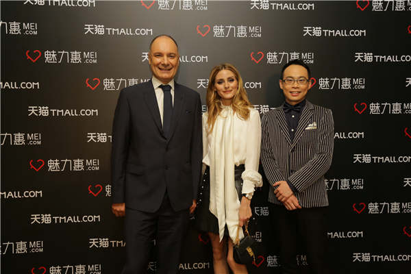 Mei.com's CEO and founder, Thibault Villet (left), with Olivia Palermo and president of Mei.com, Seamon Shi (right). Photos provided to China Daily
