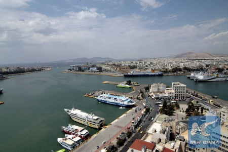 Ships are docked at Piraeus port in Athens, Greece on Feb. 17, 2016. (Xinhua/Marios Lolos)