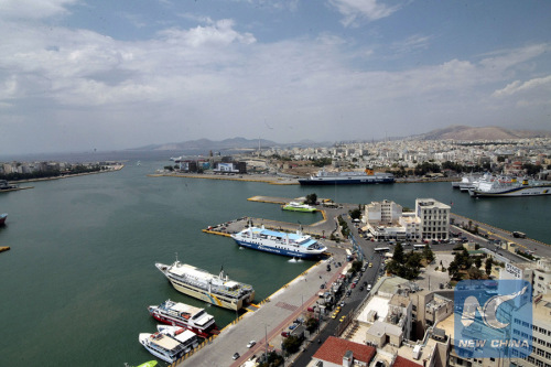 Ships are docked at Piraeus port in Athens, Greece on Feb. 17, 2016. (Xinhua/Marios Lolos)