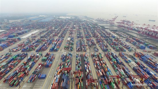 This aerial photo taken on March 29, 2016 shows a view of the free trade zone in Shanghai, east China. China's GDP stood at 15.9 trillion RMB yuan (2.4 trillion U.S. dollars) in the first quarter this year, growing up by 6.7 percent year on year, the National Bureau of Statistics said on April 15, 2016. (Xinhua/Ding Ting)