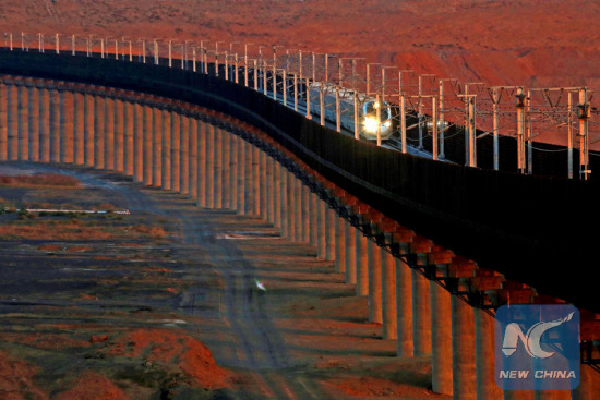 File photo taken on Nov. 24, 2015 shows a bullet train running on the Lanzhou-Xinjiang high-speed railway, in northwest China's Xinjiang Uygur Autonomous Region. (Photo: Xinhua/Cai Zengle)