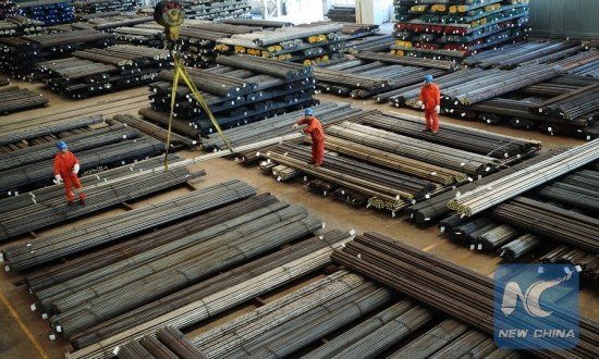Workers are busy at a manufacture base of Dongbei Special Steel Group Co., Ltd. in Dalian, northeast China's Liaoning Province, Oct. 13, 2015. (Photo: Xinhua/Liu Debin)