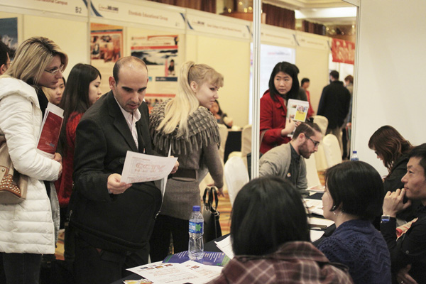 A recruitment fair sponsored by the State Administration of Foreign Experts Affairs attracted foreigners in Beijing. The number of foreign employees could grow, experts say. (Photo by Wang Jing/China Daily)