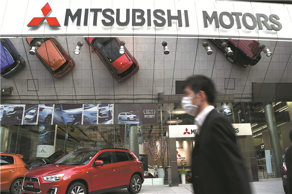 Mitsubishi Motors' headquarters in Tokyo. The Japanese automaker admitted on April 20 that it manipulated fuel economy data in more than 600,000 vehicles. CHINA DAILY